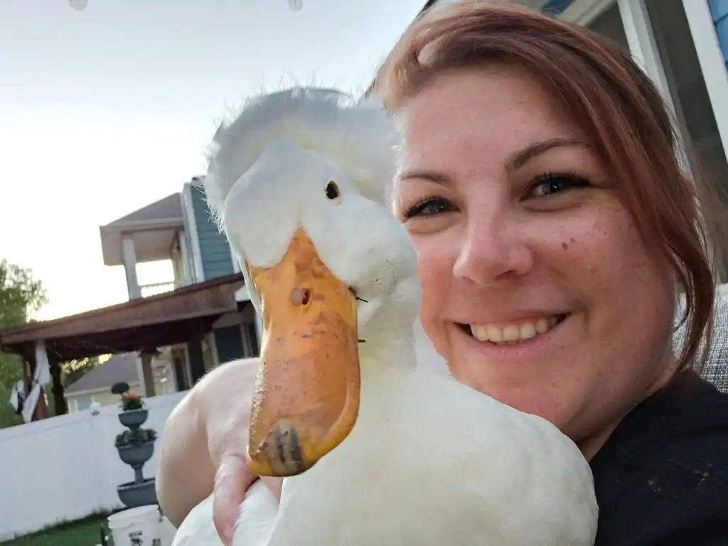 Melanie, the face behind ducks of providence with her duck Emma