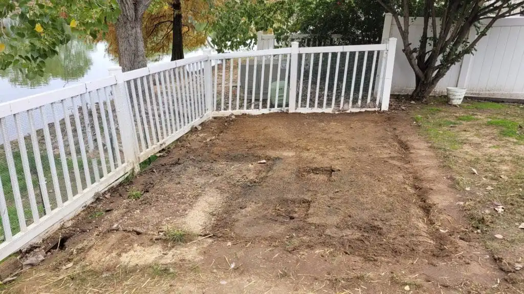 installing artificial turf for the duck run