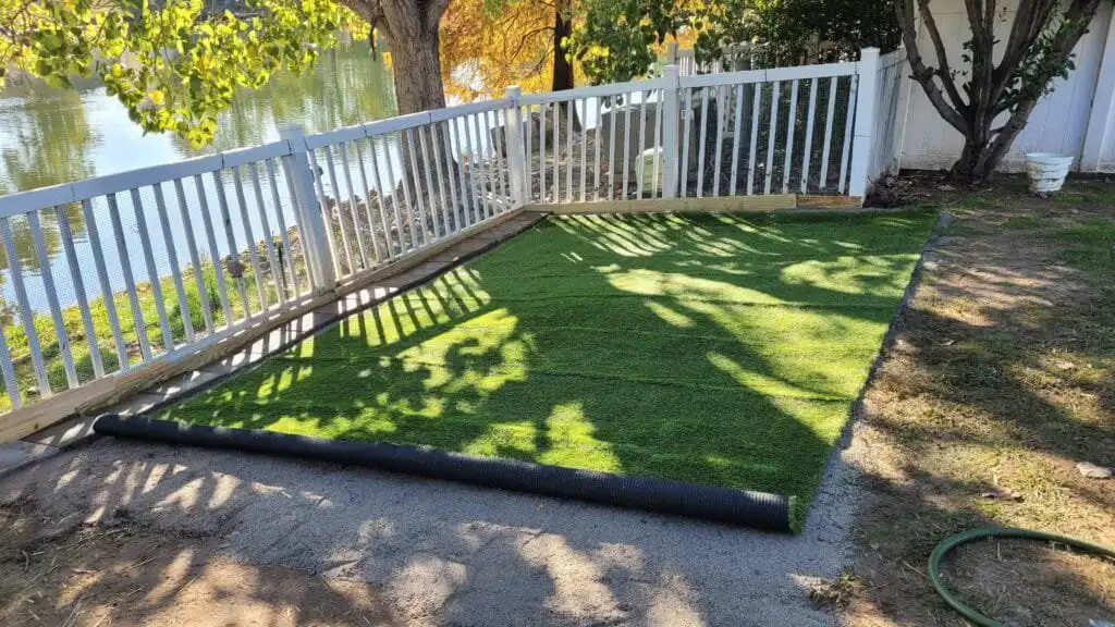 installing artificial turf for the duck run