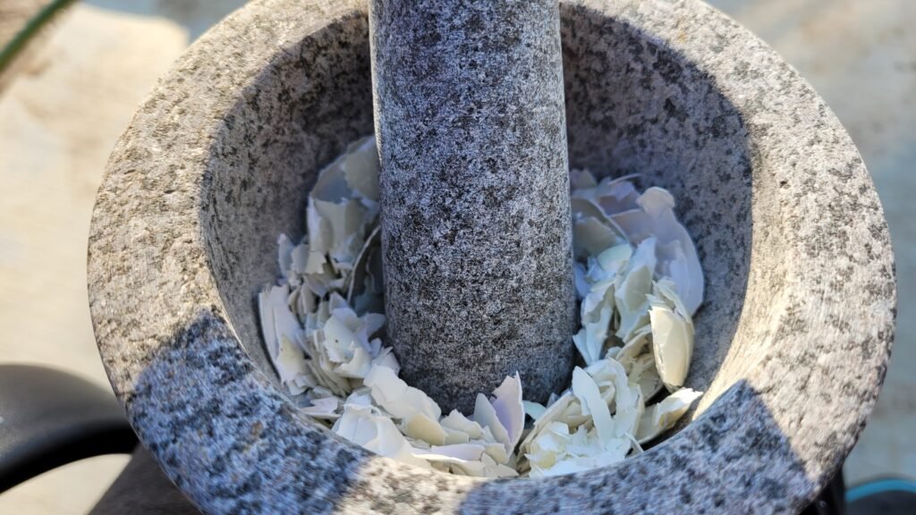 providing calcium for ducks by crushing egg shells